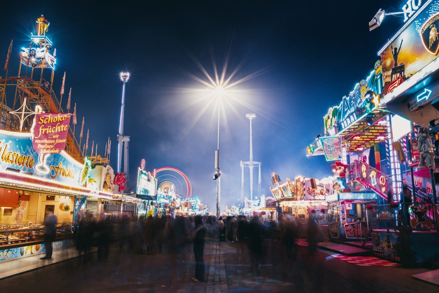Abstract long-exposure fine art photograph of the Cannstatter Wasen, showing kinetic light trails and atmospheric motion in a minimalist composition.